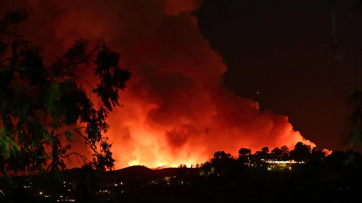 'Dangerous and strong' winds threaten to spread LA inferno