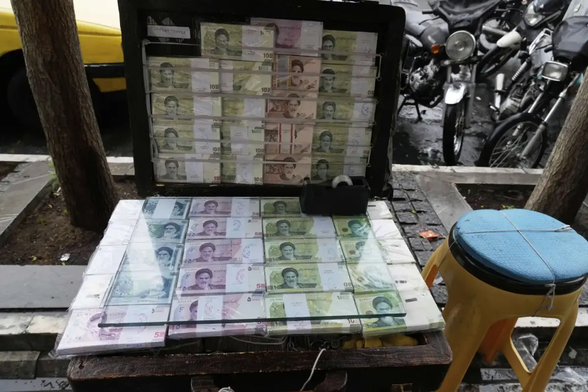Iran’s currency falls to a record low against the dollar as tensions run high