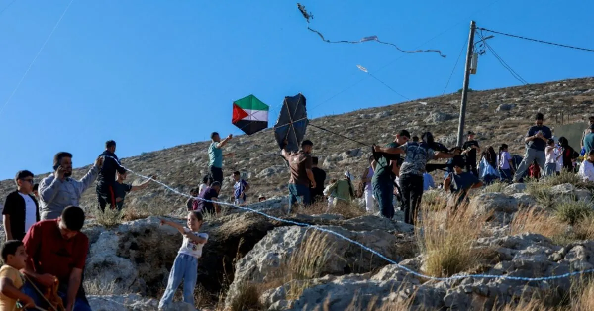 Palestinians Fly Kites in West Bank Village Amid Settlement Tensions